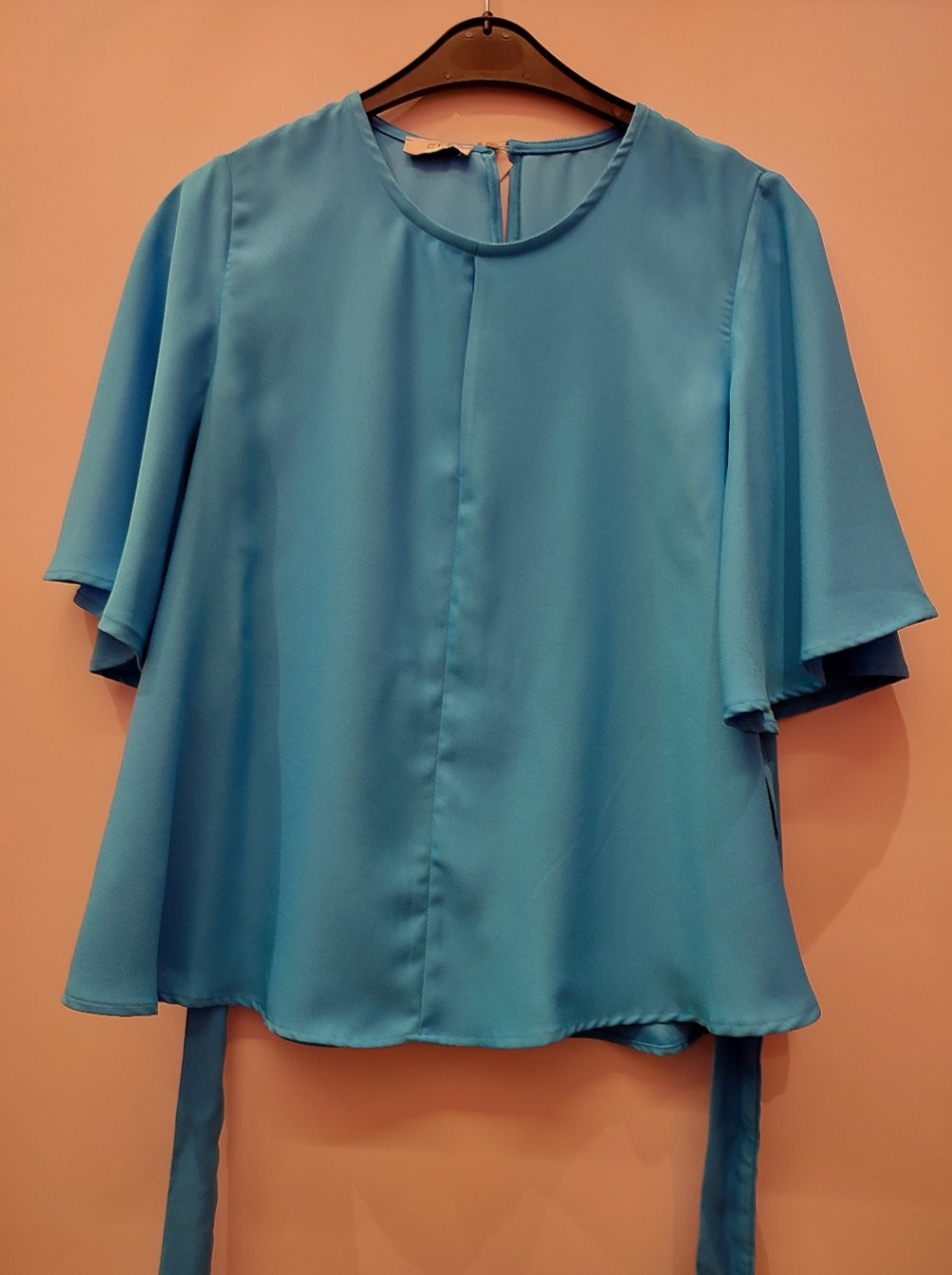 Blusa con maniche a campana